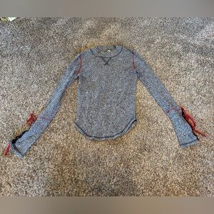Gray long sleeve shirt with red ties on sleeve Free People